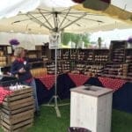 Sombrilla para mercados Symo en el puesto de Heidi y Koen Beirens